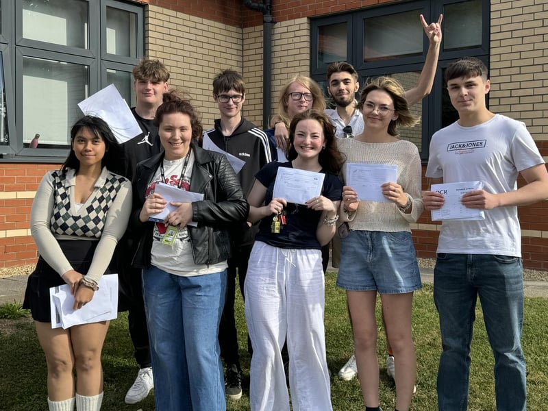 Students collect their results at Boston College.