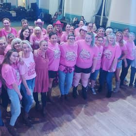 Many of the line-dancers who took part in the fundraising 'Pink Rodeo', dressed in pink or wearing cowboy attire.