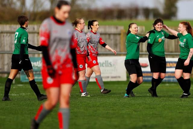 Steph Bradshaw celebrates finding the net.