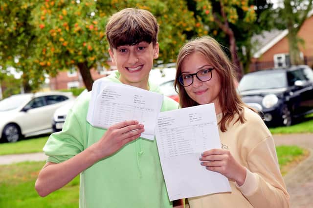 Cousins James and Grace Russell celebrate their exam results together.