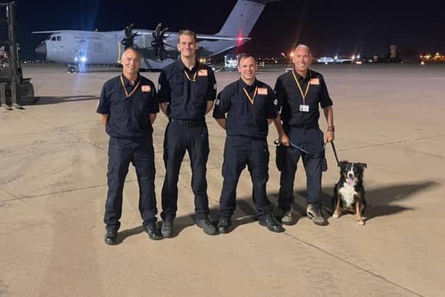 Darren Burchnall, Ben Clarke, Karl Keuneke and Neil Woodmansey with Colin the rescue dog.