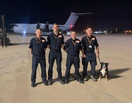 Darren Burchnall, Ben Clarke, Karl Keuneke and Neil Woodmansey with Colin the rescue dog.