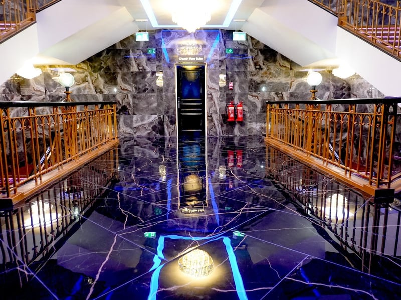 The shiny floors reflect the overhead lighting