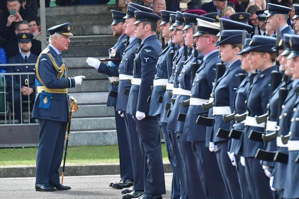 "Have we met before?"" Prince Charles shares a joke on the parade ground at RAF College Cranwell during the graduation parade.