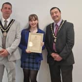 Summer Willets, 14, receives her Community Award from the new Mayor of Skegness Coun Adrian Findley and Deputy Mayor Coun Jimmy Brookes.