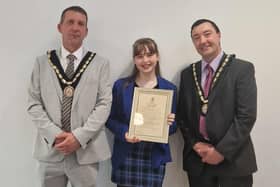 Summer Willets, 14, receives her Community Award from the new Mayor of Skegness Coun Adrian Findley and Deputy Mayor Coun Jimmy Brookes.