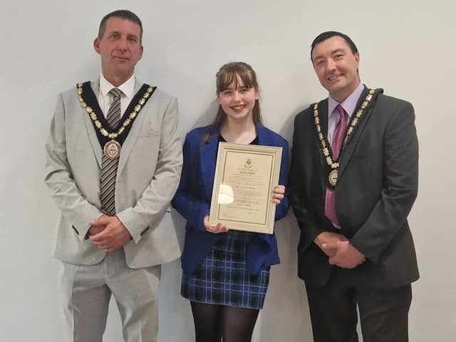 Summer Willets, 14, receives her Community Award from the new Mayor of Skegness Coun Adrian Findley and Deputy Mayor Coun Jimmy Brookes.