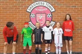 Skegness Town JFC ceering on the Lionesses with coaches from their AFC women's team.