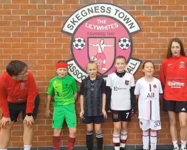 Skegness Town JFC ceering on the Lionesses with coaches from their AFC women's team.