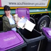 SKDC Cabinet Member for Environment and Waste, Coun Patsy Ellis, demonstrating what to put in the new purple bins for South Kesteven households. Photo: SKDC