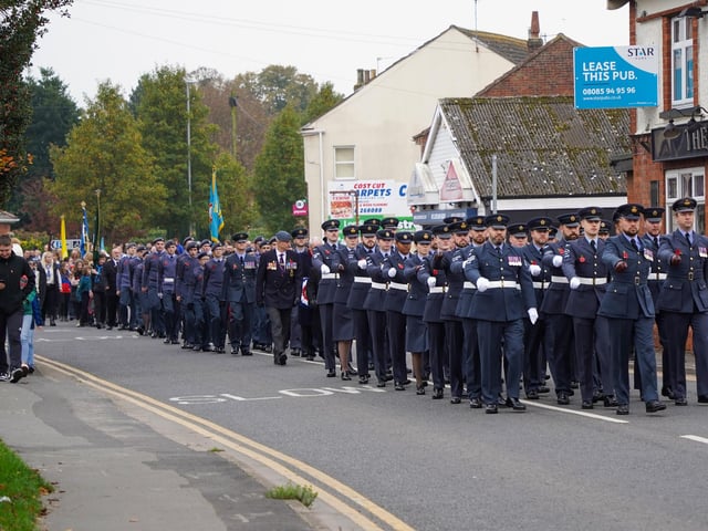 The parade through Coningsby for Remembrance Sunday, watched by locals. Photo: Keith Bishop