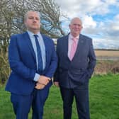 Coun Carl Macey and Coun Colin Davie stood alongside the proposed pylon route in Burgh le Marsh.