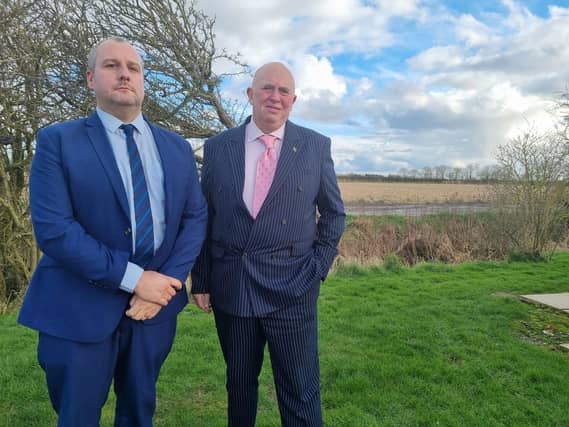 Coun Carl Macey and Coun Colin Davie stood alongside the proposed pylon route in Burgh le Marsh.