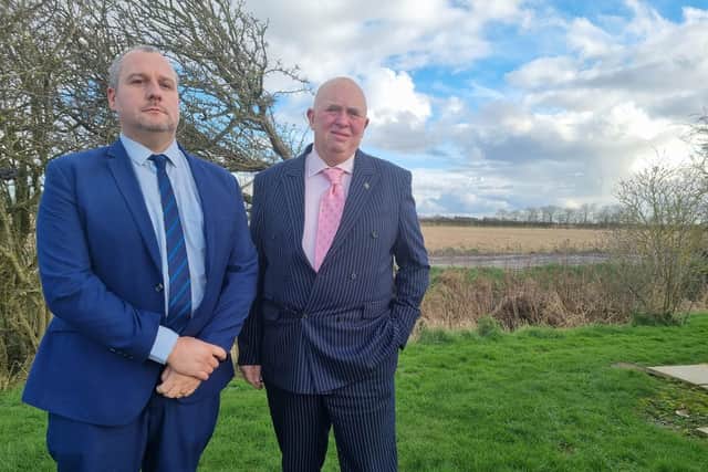 Coun Carl Macey and Coun Colin Davie stood alongside the proposed pylon route in Burgh le Marsh.