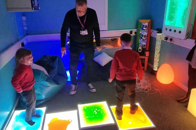 Staff and youngsters try out the new sensory room at Coningsby St Michael's Church Of England Primary School.
