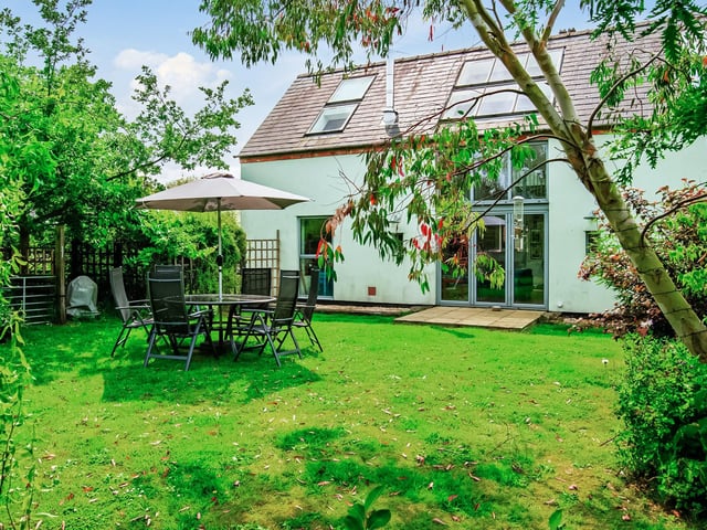 Relax in the scenic garden with the sound of nearby sheep. Photo: Hope & Glory