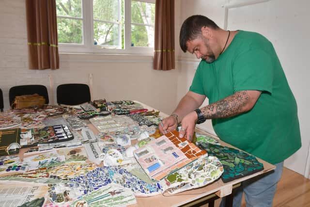 Nils Wilkinson working on the Horncastle mosaic. Photo: David Dawson