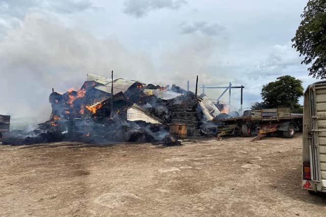 The cattle yard and hay sheds were still smouldering several days after the fire.
