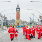 Santas set off on an annual fun run in Skegness.