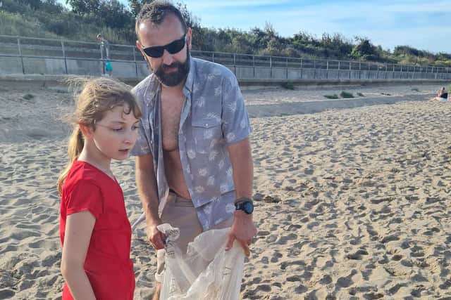 Sofia and her dad, Ray, picked three bags of rubbish altogether.
