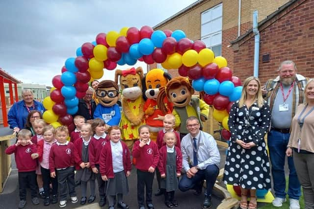 Pupils at Chapel St Leonard’s Primary School celebrating with opening of their play area with guests.