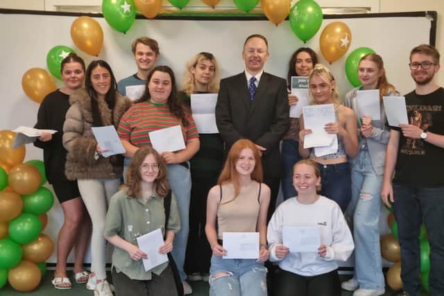 Jude Hunton, Headmaster at Skegness Grammar, with students celebrating their A-level results.