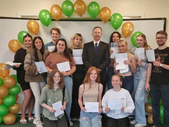 Jude Hunton, Headmaster at Skegness Grammar, with students celebrating their A-level results.