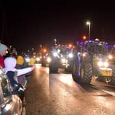 Harmston YFC members' cavalcade of tractors through Navenby's Christmas lights event. Photo: David Dawson