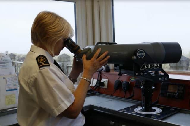 A National Coastwatch Institution volunteer keeps watch on the Mablethorpe coast.
