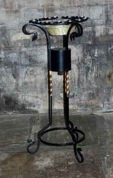 The stolen candle holder.