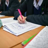 Students write in their exercise books in class at Royal High School Bath, which is a day and boarding school for girls aged 3-18 and also part of The Girls' Day School Trust, the leading network of independent girls' schools in the UK. 