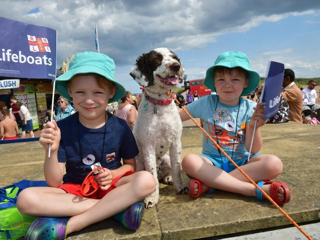 Flying the RNLI Flag - Arthur Worrall, 7,  and Eddie Worrall, 4, with their dog Maple.