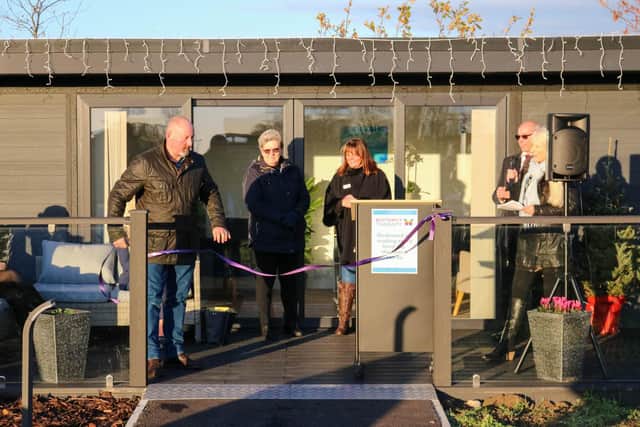 The ribbon is cut to officially open the new Therapy Village.