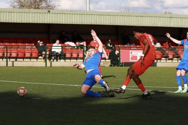 Akeel Francis slides home the second Sleaford goal. Photo: Steve W Davies Photography.