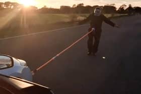John Stephenson pulls the Renault Laguna Coupe using the end of his penis in strongman stunt. Photo: Jane Pumphrey / SWNS