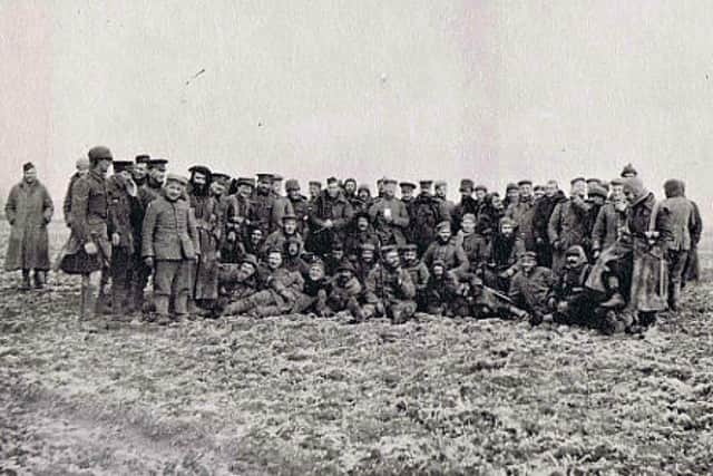 Gordon Highlanders posing for the camera with German soldiers in No Man’s Land on Christmas Day 1914