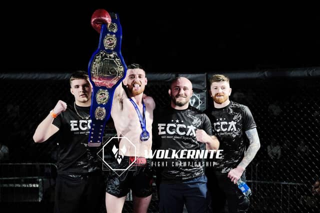 Alex Underwood with his new championship belt.