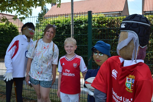 Harry Hewson (9) and Tiegan Carter with the Rugby scarecrows