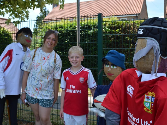 Harry Hewson (9) and Tiegan Carter with the Rugby scarecrows