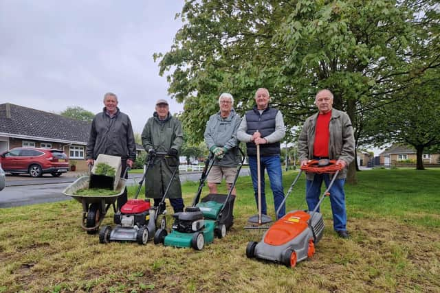 Residents in their eighties who are cuttng grass, supported by Coun Steve O'Dare (second right).