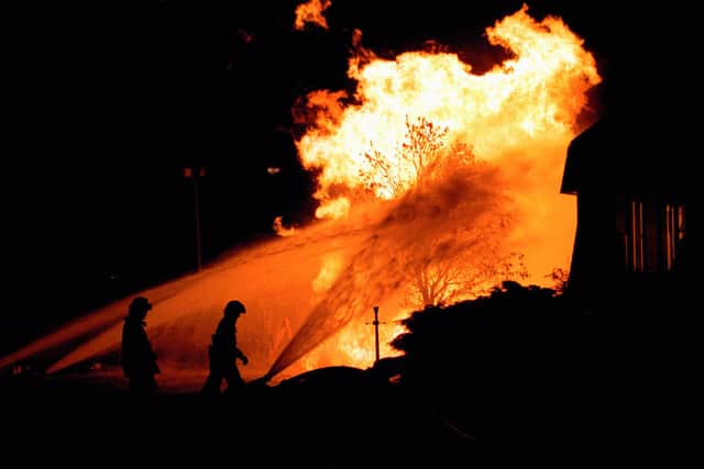 Firefighters at the scene of the gas explosion in Runcorn, Cheshire, which left four people badly burned.