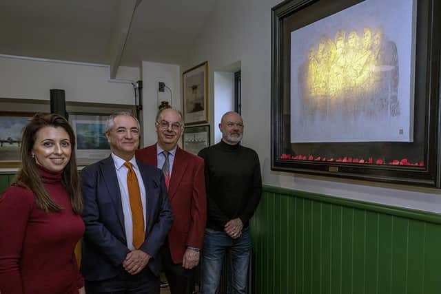 The unveiling of the painting showing Louise Bush and Phillip Panton (third left), of the Lincolnshire Aviation Heritage Centre, with artist Andy Finlay (right) and Chris Lowe, who commissioned the work. (PHOTO BY: Martin Keen).
