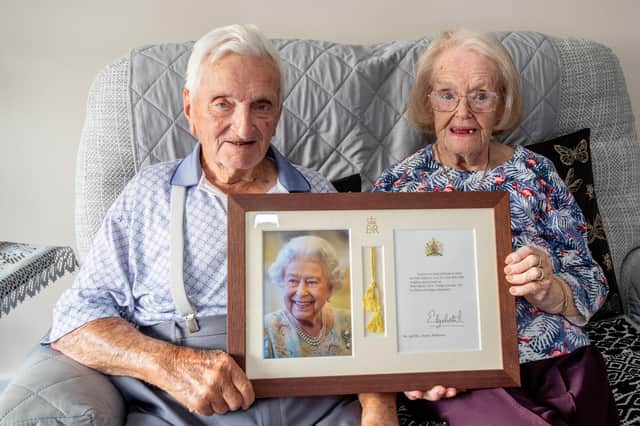 Dennis and June Wilkinson of Hagworthingham with their signed photo and card.