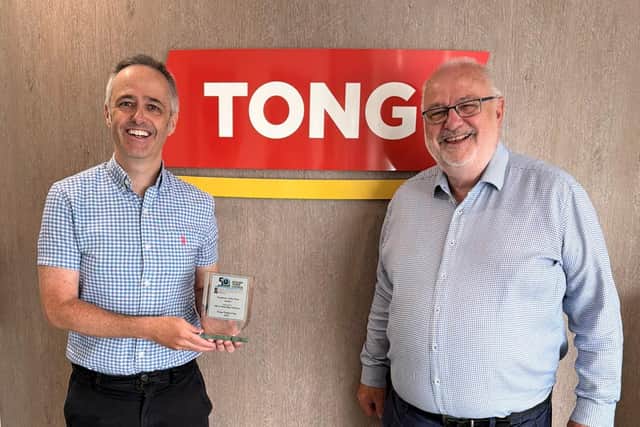 Edward Tong (left) and Charles Tong (right) with the Spilsby Recognition Award.