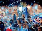 Sergio Aguero holds the Premier League trophy aloft after his injury-time heroics in 2012.