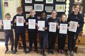 Year 5 & 6 pupils from Wyberton Primary Academy with their festive card designs
