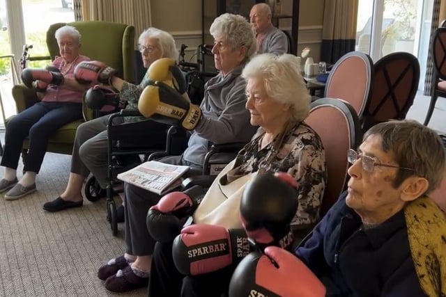 Sleaford manor care home residents have a go at the boxing fitness session.