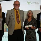 Vaughan Hughes, secretary, and Gill Vollentine, committee member, (centre) receiving the certificates and awards at the EMIB presentation event