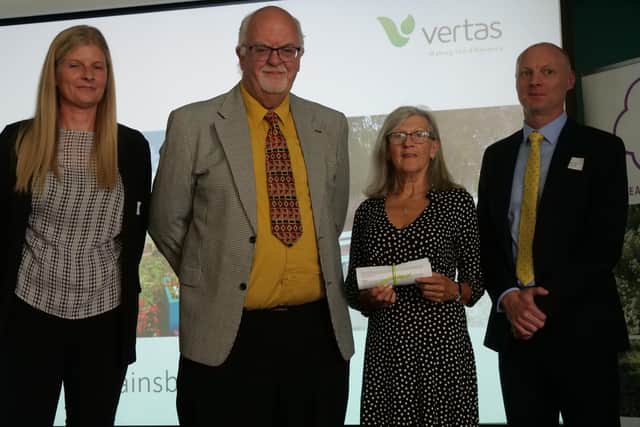Vaughan Hughes, secretary, and Gill Vollentine, committee member, (centre) receiving the certificates and awards at the EMIB presentation event