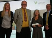 Vaughan Hughes, secretary, and Gill Vollentine, committee member, (centre) receiving the certificates and awards at the EMIB presentation event